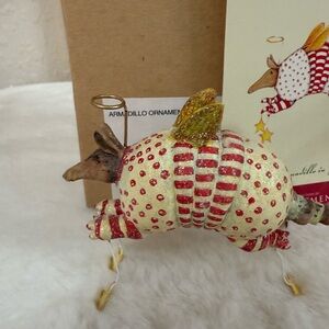 Krinkles Armadillo Ornament with Red and Gold Details